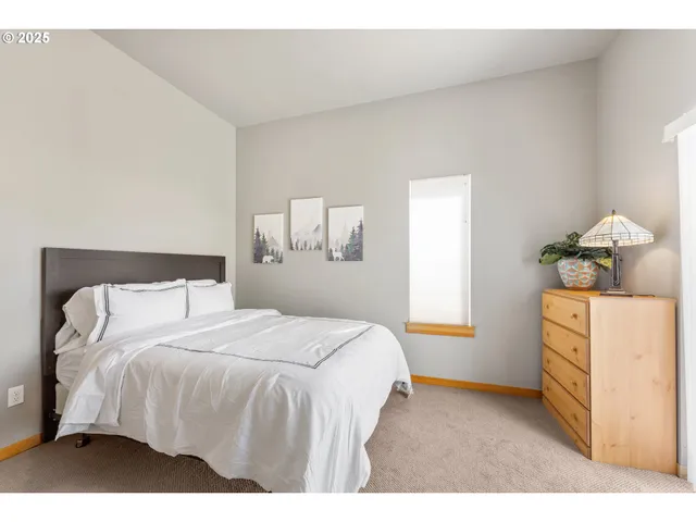 a bedroom with a bed and a cabinets