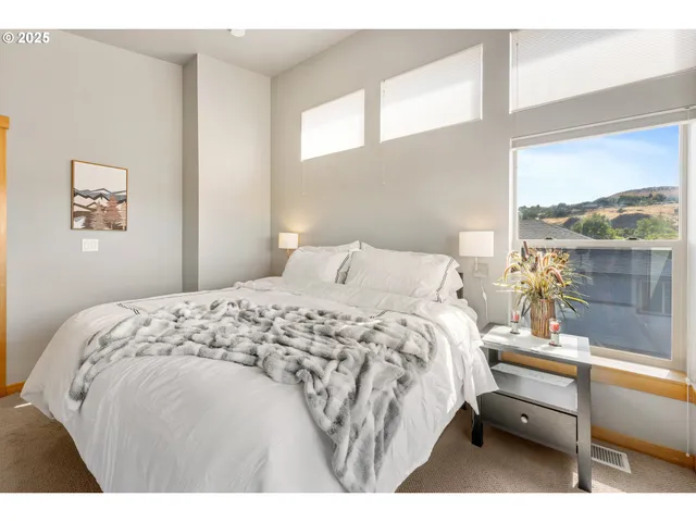 a bedroom with a bed and window