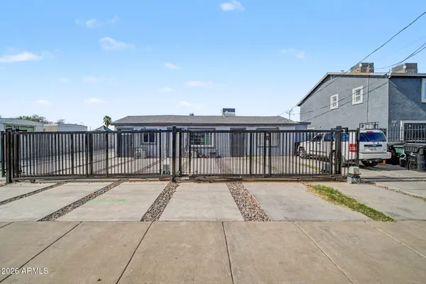a view of a brick house with many windows