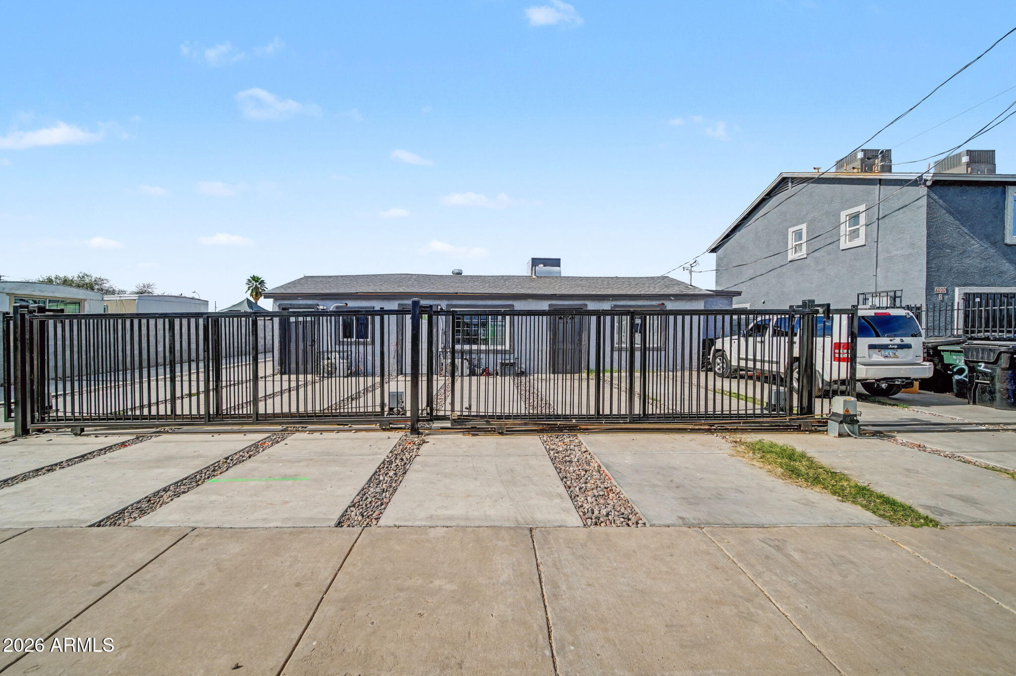 a view of a brick house with many windows