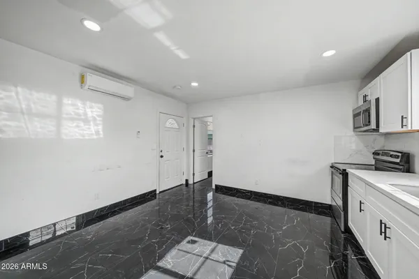 a view of a storage & utility room with window