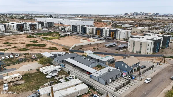 an aerial view of a house with a city view