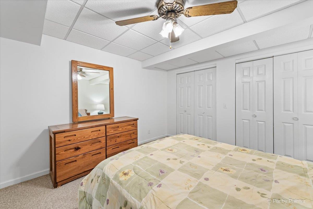 19-14 Timber Ridge Road Lanark, IL 61046 - Photo 32 of 55 a bedroom with a bed and a dresser
