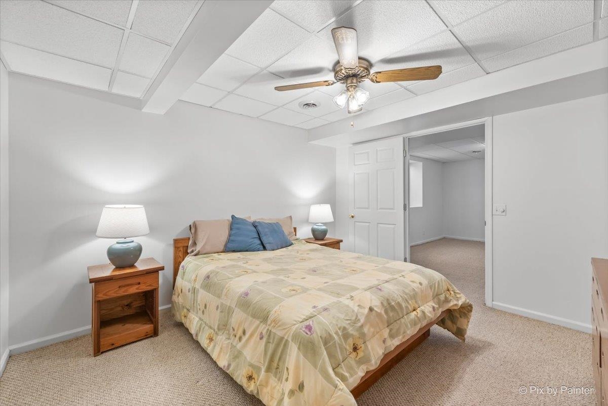 19-14 Timber Ridge Road Lanark, IL 61046 - Photo 33 of 55 a bedroom with a bed and a ceiling fan