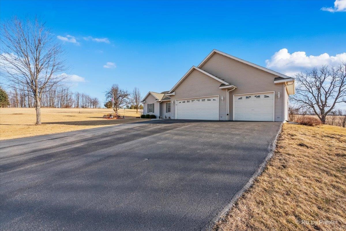 19-14 Timber Ridge Road Lanark, IL 61046 - Photo 36 of 55 a view of an house with backyard and trees