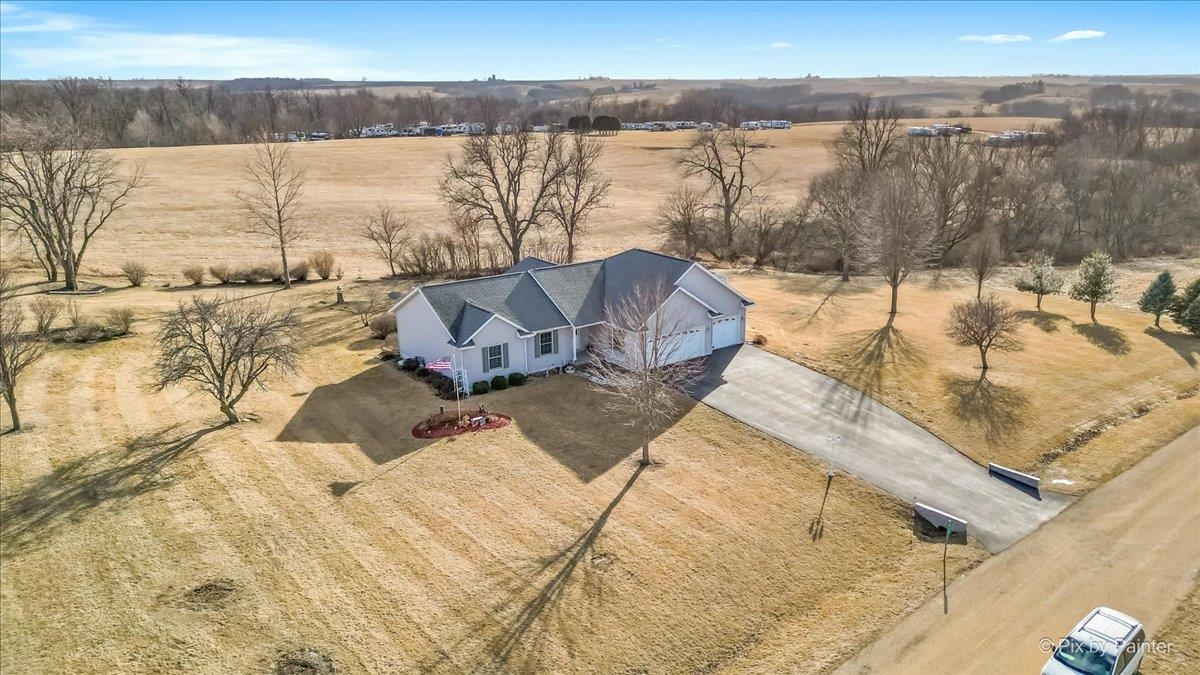 19-14 Timber Ridge Road Lanark, IL 61046 - Photo 4 of 55 a view of a lake with a mountain