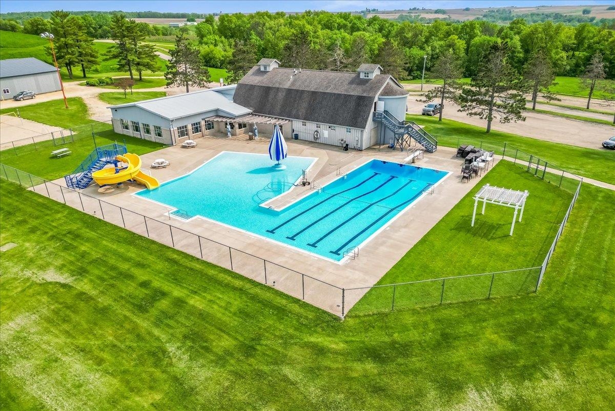 19-14 Timber Ridge Road Lanark, IL 61046 - Photo 50 of 55 a view of an house with pool and a yard