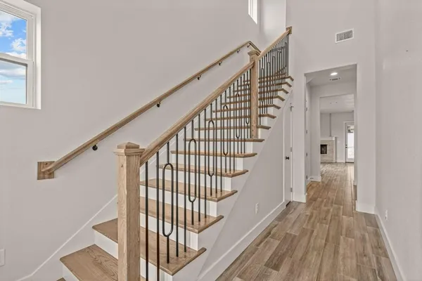 a view of entryway with wooden floor