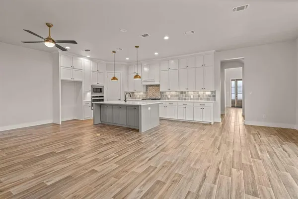 a view of kitchen with wooden floor and window