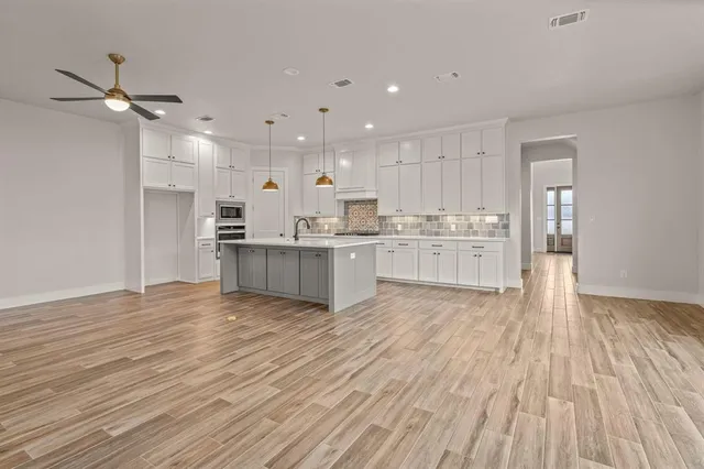 a view of kitchen with wooden floor and window