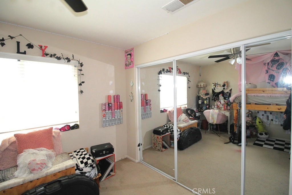 924 Condor Street Barstow, CA 92311 - Photo 28 of 52 a bedroom with furniture and a couch
