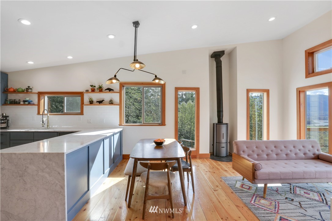 28740 Bacus Road Sedro-Woolley, WA 98284 - Photo 12 of 40 a living room with furniture and a chandelier