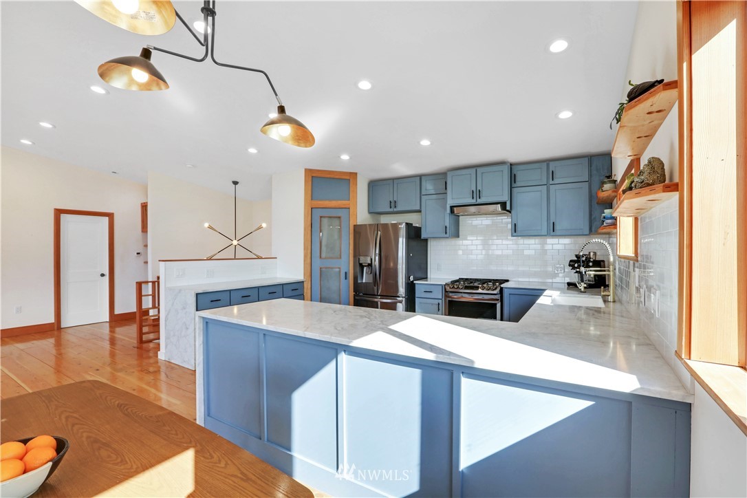 28740 Bacus Road Sedro-Woolley, WA 98284 - Photo 15 of 40 a kitchen with stainless steel appliances granite countertop a sink refrigerator and cabinets