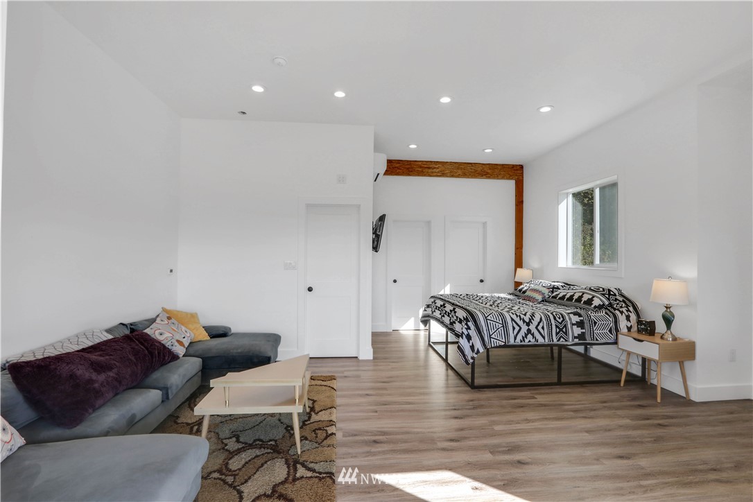 28740 Bacus Road Sedro-Woolley, WA 98284 - Photo 28 of 40 a spacious bedroom with a bed and a couch