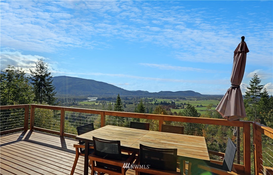 28740 Bacus Road Sedro-Woolley, WA 98284 - Photo 4 of 40 a view of a city from a balcony with furniture