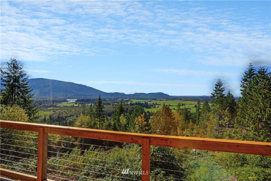 28740 Bacus Road Sedro-Woolley, WA 98284 - Photo 5 of 40 a view of a balcony next to a yard