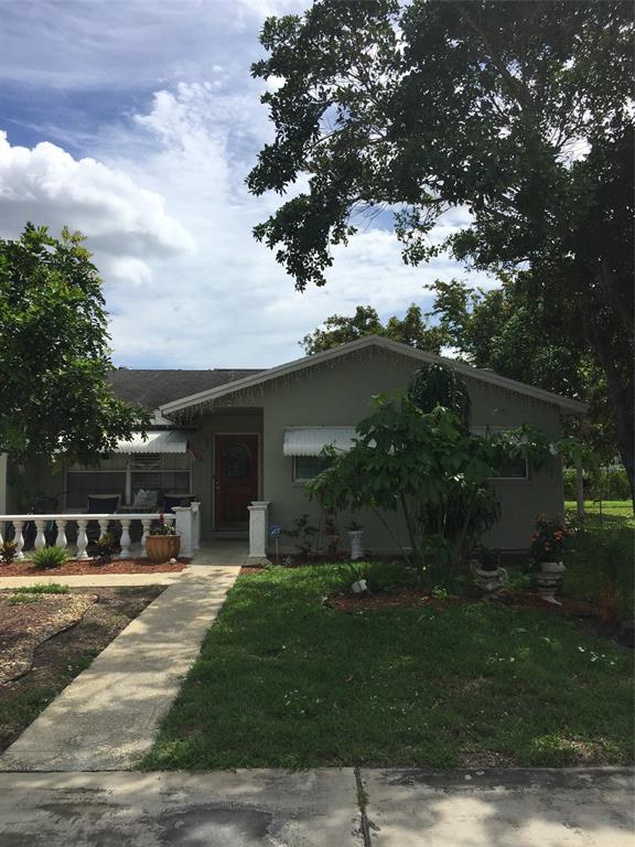 22720 Southwest 64th Way Boca Raton, FL 33428 - Photo 1 of 8 a front view of a house with a yard