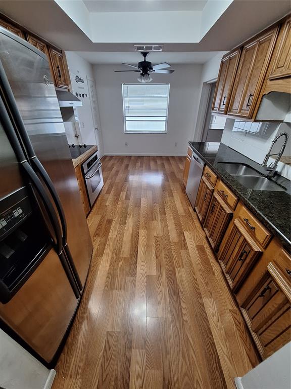 22720 Southwest 64th Way Boca Raton, FL 33428 - Photo 3 of 8 a view of an empty room with wooden floor