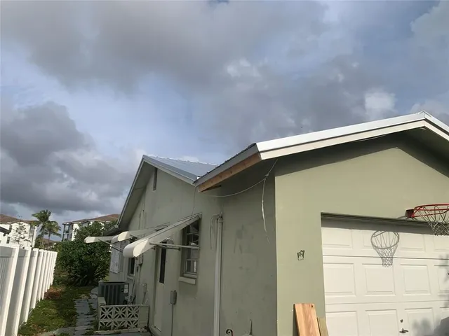 a house with trees in front of it