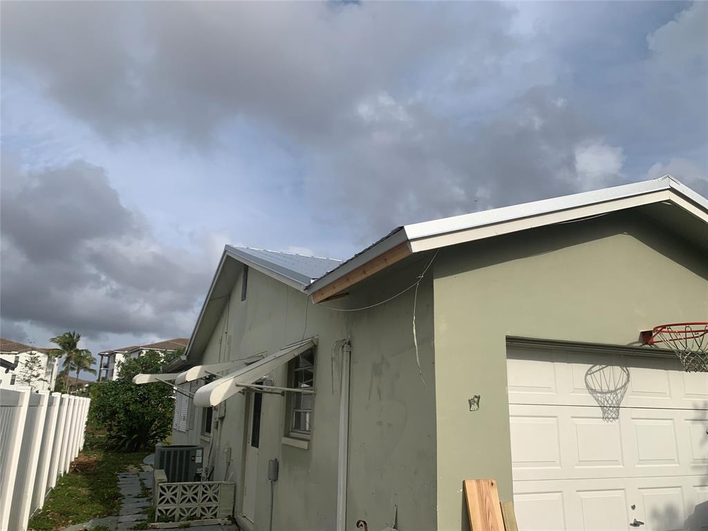 22720 Southwest 64th Way Boca Raton, FL 33428 - Photo 5 of 8 a house with trees in front of it