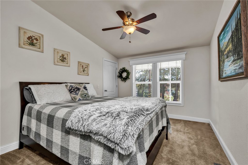 14986 Western Mine Road Middletown, CA 95461 - Photo 19 of 60 a bedroom with a large bed and a window