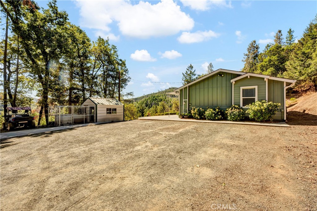 14986 Western Mine Road Middletown, CA 95461 - Photo 25 of 60 a view of a house with a yard and plants