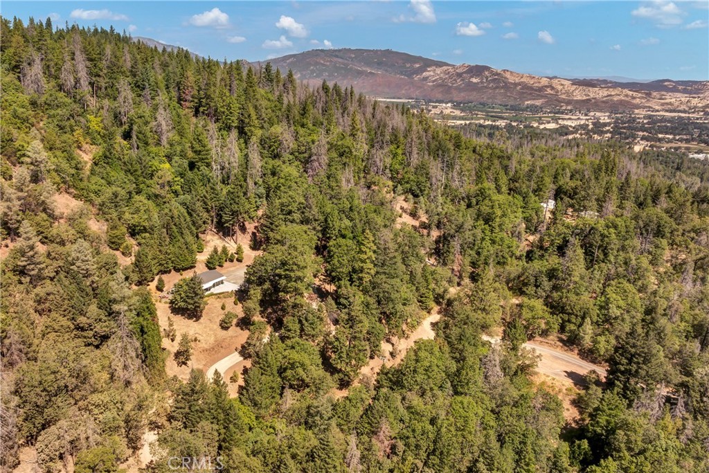 14986 Western Mine Road Middletown, CA 95461 - Photo 52 of 60 a view of a field with a mountain in the background