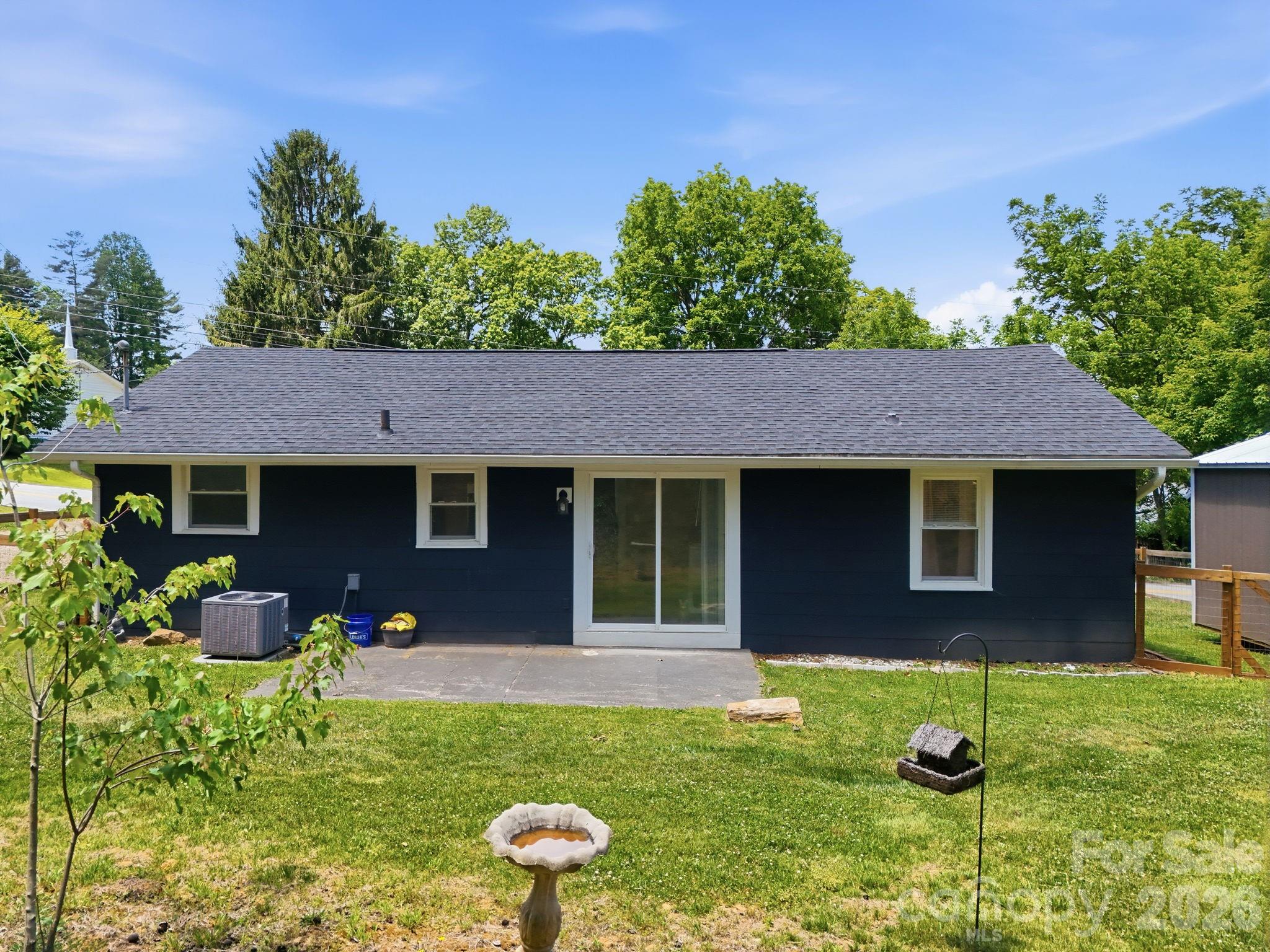 197 Mulberry Street Clyde, NC 28721 - Photo 24 of 31 a front view of a house with garden
