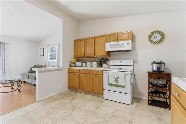 a kitchen with cabinets and window