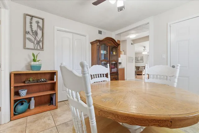 a living room with furniture and white walls