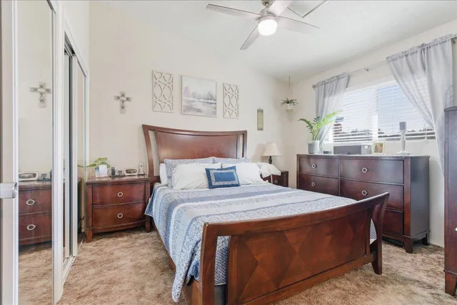 a bed room with a bed and a chandelier