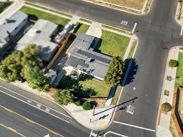 an aerial view of a house with a garden and entryway