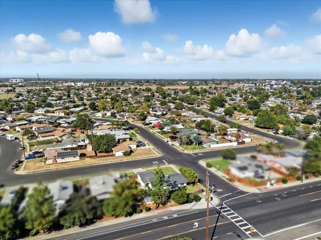 an aerial view of residential houses with outdoor space
