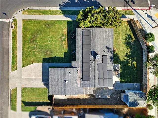 swimming pool view with a garden and plants