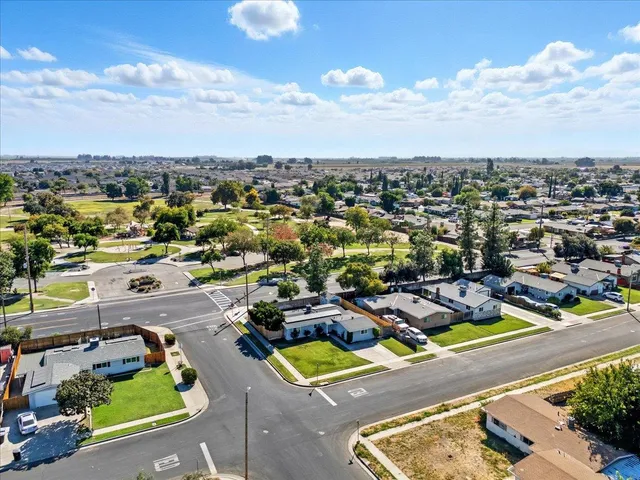 an aerial view of a swimming pool patio and mountain view
