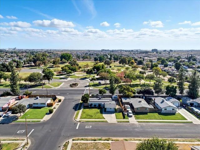 an aerial view of a yard with swimming pool