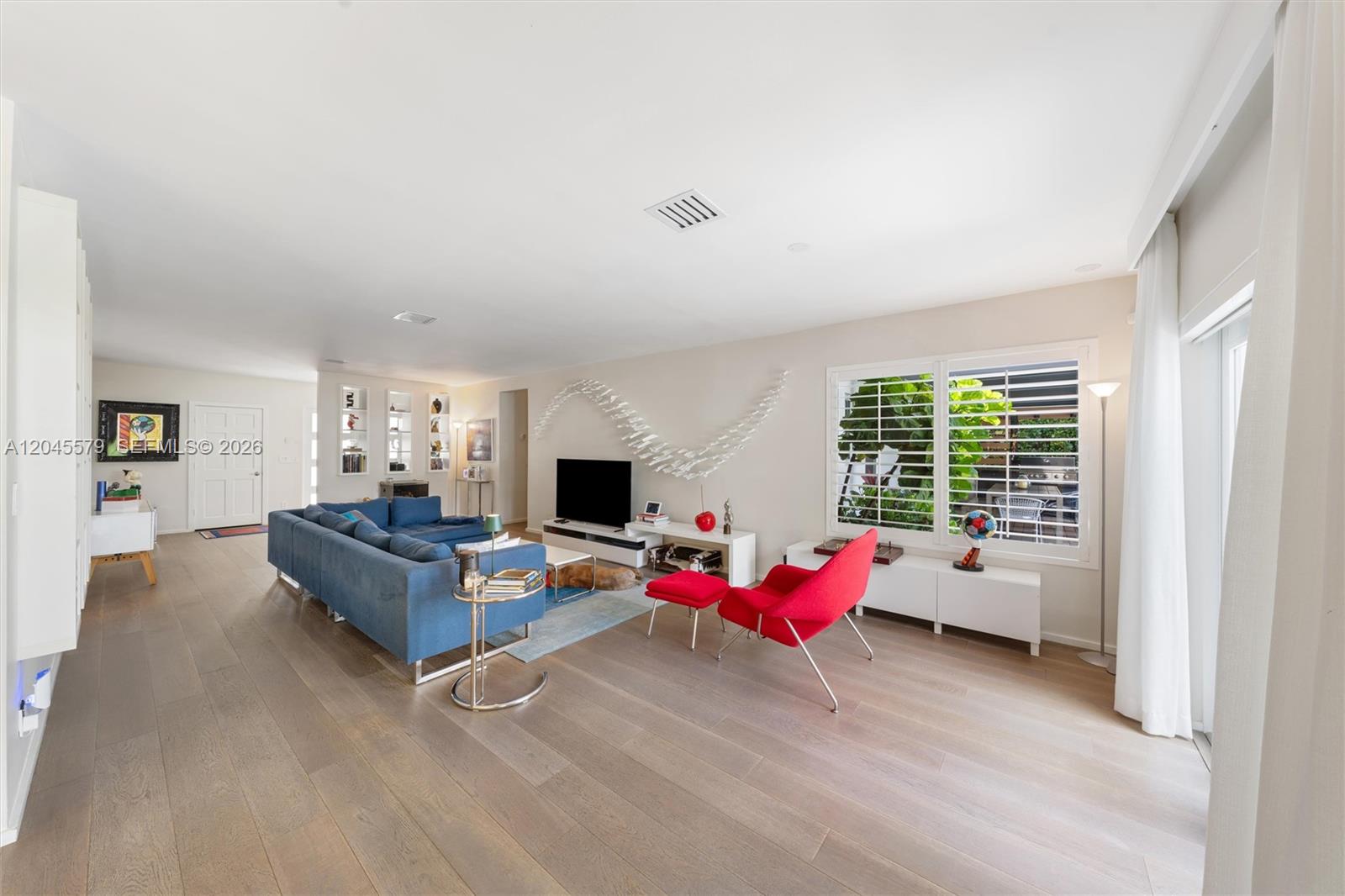 12944 Banyan Road North Miami, FL 33181 - Photo 4 of 26 a living room with furniture and flat screen tv