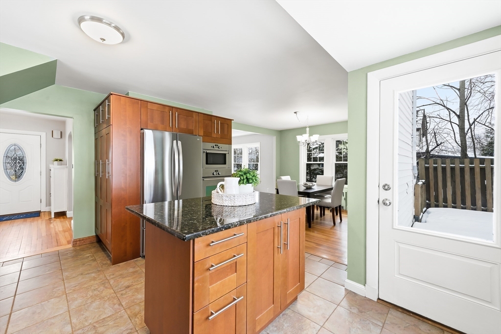 112 Ashcroft Road Medford, MA 02155 - Photo 19 of 42 a kitchen with stainless steel appliances granite countertop a refrigerator and a stove