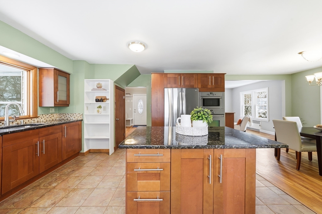 112 Ashcroft Road Medford, MA 02155 - Photo 21 of 42 a kitchen with stainless steel appliances granite countertop a refrigerator and a sink