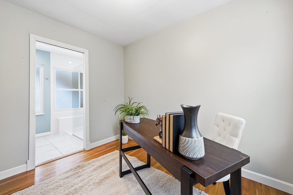 112 Ashcroft Road Medford, MA 02155 - Photo 23 of 42 a workspace with furniture and wooden floor