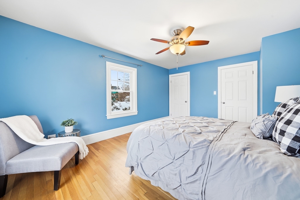 112 Ashcroft Road Medford, MA 02155 - Photo 35 of 42 a bedroom with a bed and a chair