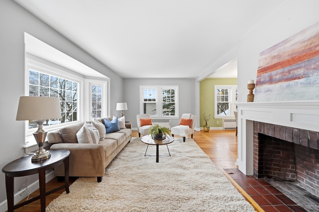 112 Ashcroft Road Medford, MA 02155 - Photo 4 of 42 a living room with furniture and a fireplace