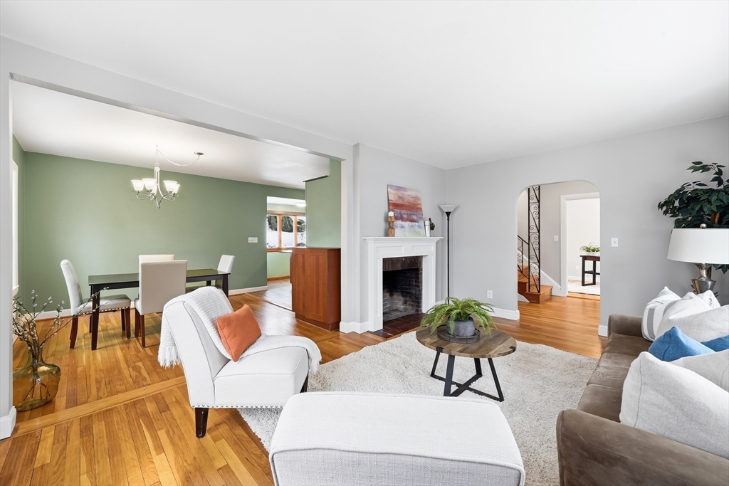 112 Ashcroft Road Medford, MA 02155 - Photo 9 of 42 a living room with furniture a fireplace and a table