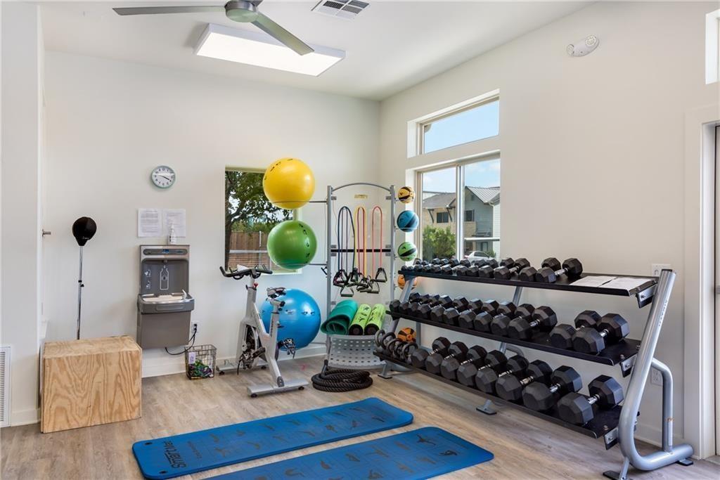 7805 Cooper Lane, Unit 601 Austin, TX 78745 - Photo 17 of 20 a living room with furniture and wooden floor