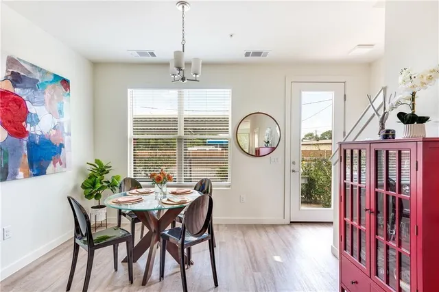 a view of a dining room with furniture window and wooden floor