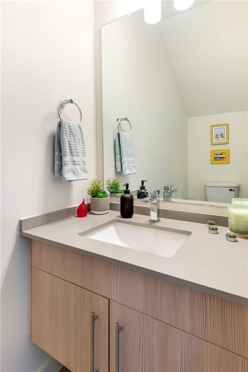 7805 Cooper Lane, Unit 601 Austin, TX 78745 - Photo 7 of 20 a bathroom with a sink and a mirror