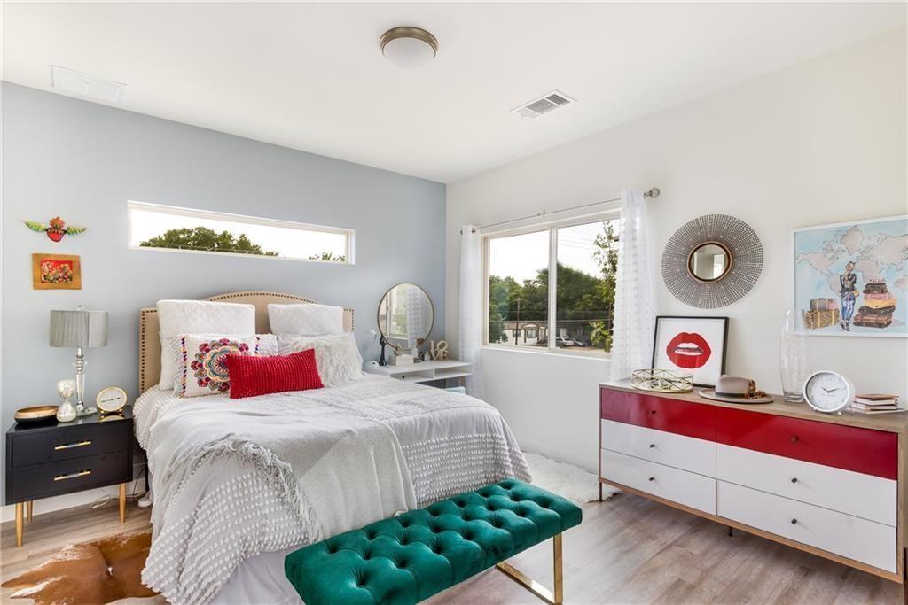 7805 Cooper Lane, Unit 601 Austin, TX 78745 - Photo 9 of 20 a bedroom with a bed and window