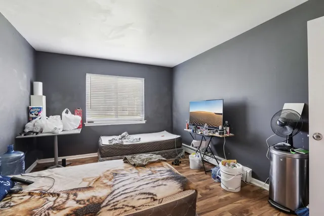 a bedroom with bed and a window