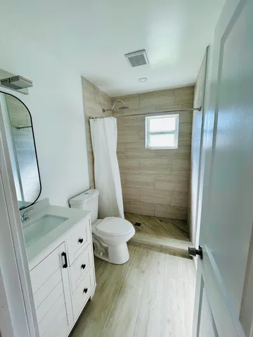 a bathroom with a sink and mirror