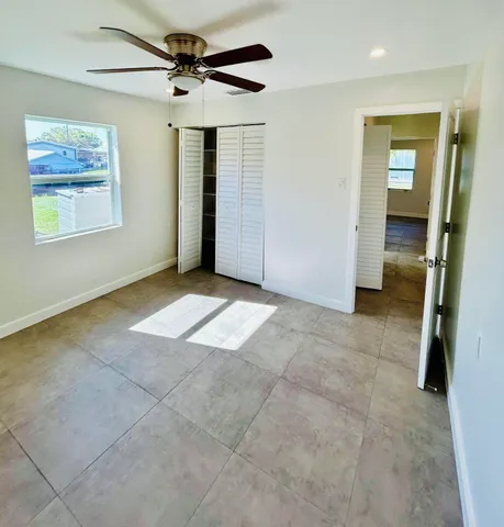 a view of livingroom with hardwood floor and a ceiling fan